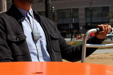 A man enjoying a day in the park with his mobile medical alert A man enjoying a day in the park with his mobile medical alert