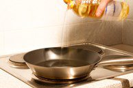Pouring Oil in Skillet Pouring Oil in Skillet