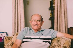 Smiling Grandpa Sitting In Chair Smiling Grandpa Sitting In Chair
