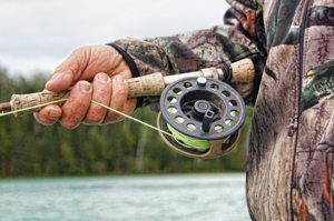 Weathered Hand Holding Fishing Pole Weathered Hand Holding Fishing Pole