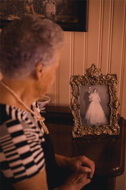 Woman Standing Next To Old Photo Woman Standing Next To Old Photo