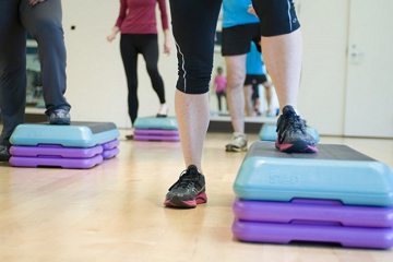 people doing step training aerobic exercise people doing step training aerobic exercise