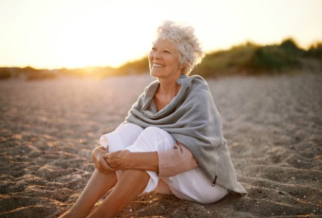 Woman smiling on the beach.