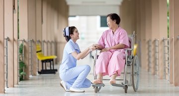 caregiver helping cripple caregiver helping cripple