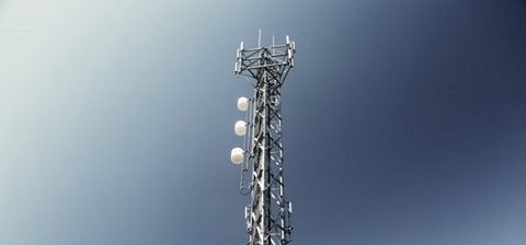 A cell tower with blue skies A cell tower with blue skies
