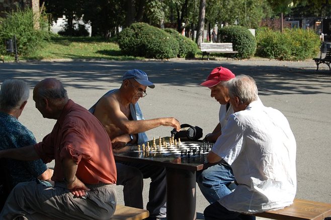 men playing chess men playing chess