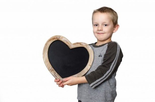 kid with blackboard heart kid with blackboard heart