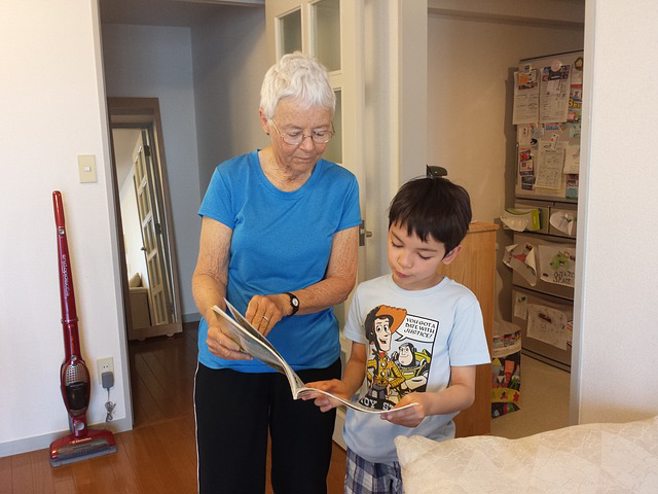 senior helping child