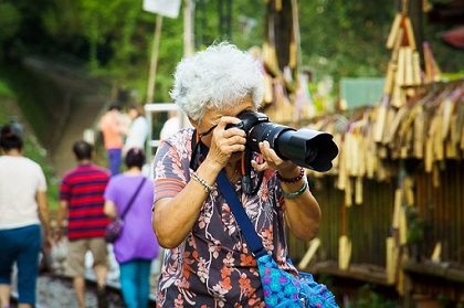 A woman taking a picture with her DSLR camera A woman taking a picture with her DSLR camera