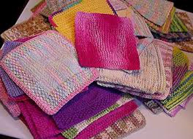 pile of colorful crochet dishcloths pile of colorful crochet dishcloths