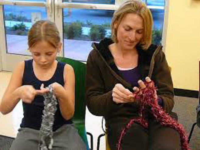mother and daughter knitting together