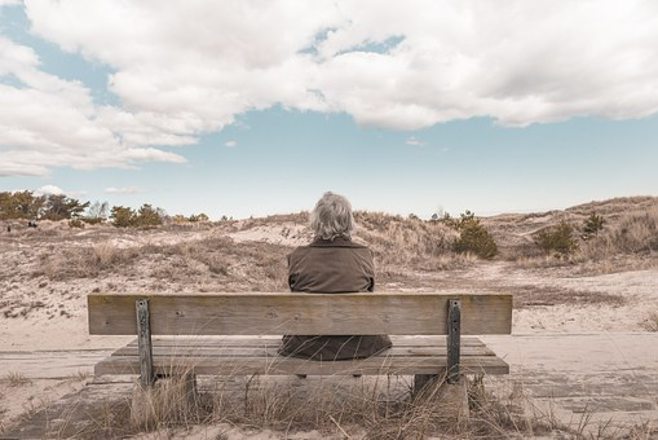 grandma on bench in desert grandma on bench in desert