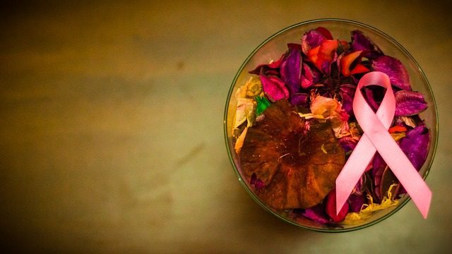 pink ribbon in a bowl of leaves pink ribbon in a bowl of leaves
