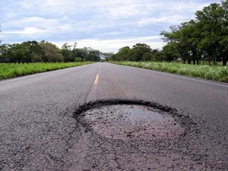 A pothole on a street A pothole on a street