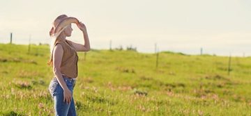 woman looking at grass field woman looking at grass field