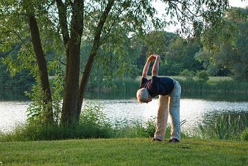 yoga man stretching outdoors yoga man stretching outdoors